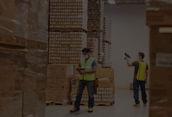 two workers in a warehouse